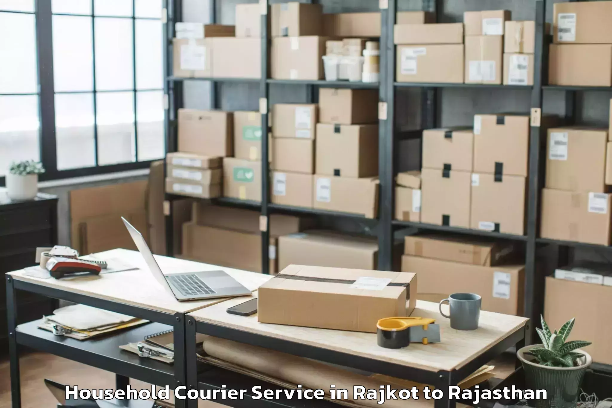 Reliable Rajkot to Opjs University Churu Household Courier